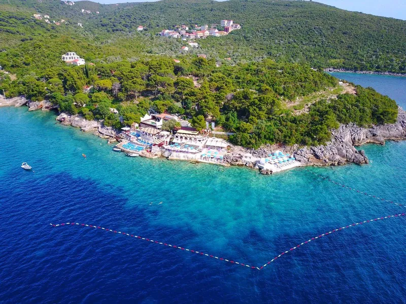 Blue Cave and Beach Transfer - 6h Zanjice Beach with clear turquoise water and sunbathers near Herceg Novi